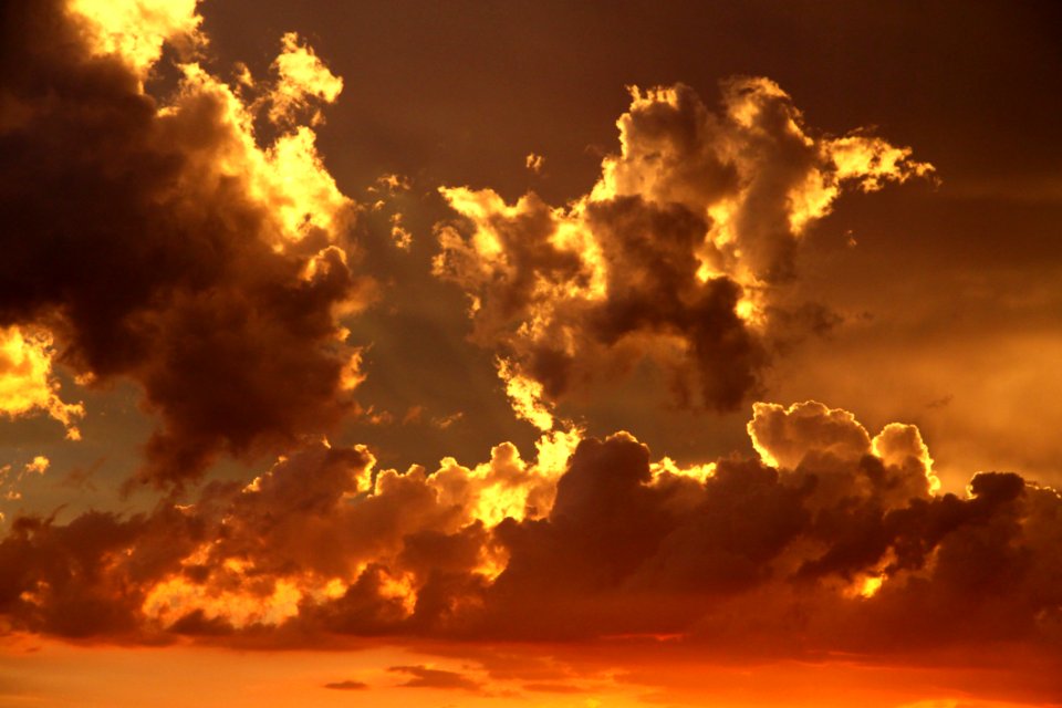 Nimbus Clouds On Clear Blue Sky During Golden Hour