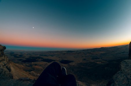Orange Dawn Over Dark Landscape