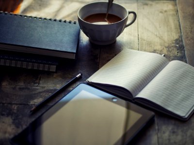 Books And Tablet On Table