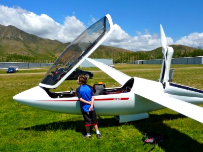Child Looking At An Airplane