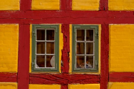 Windows In Red And Yellow Building photo