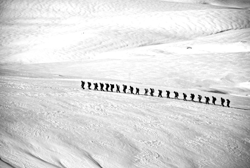 People Walking On Snow Field Grayscale Photography