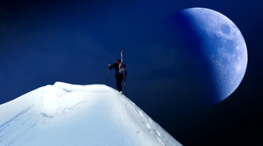 Mountain Climber Reaching A Summit photo