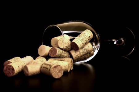 Brown Corks On Clear Wine Glass photo