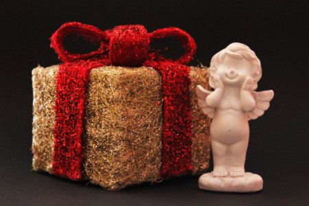 Christmas Present And Angel Statue