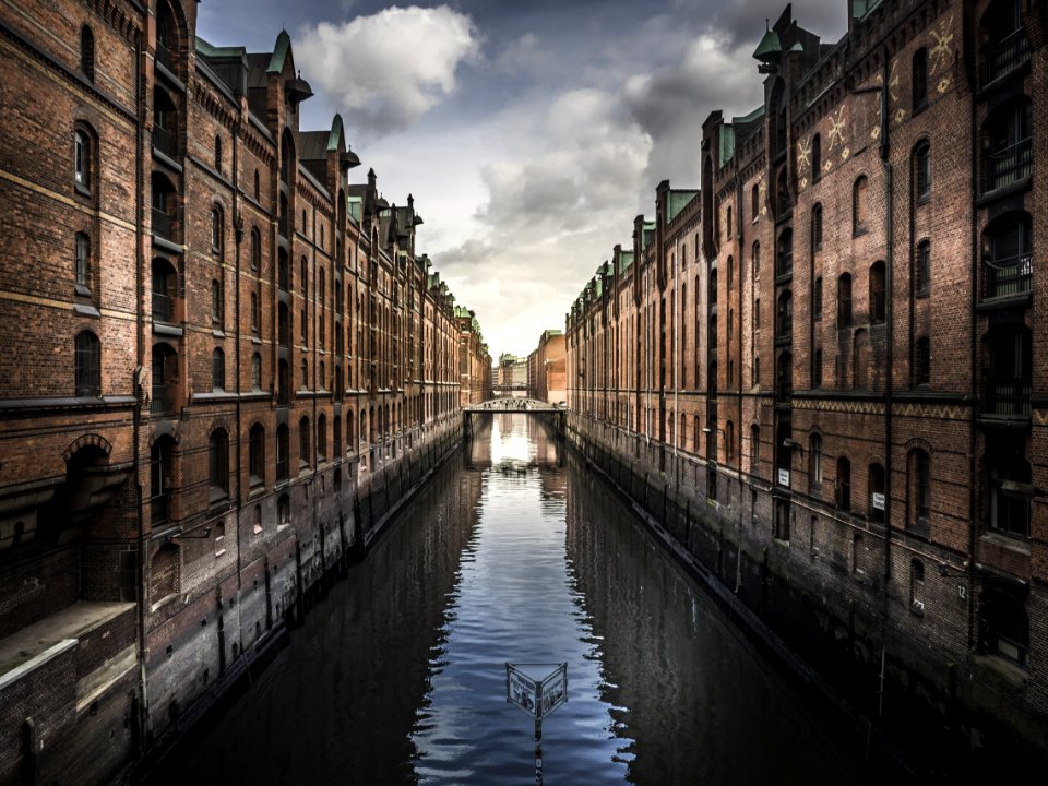 Buildings Reflecting In Canal