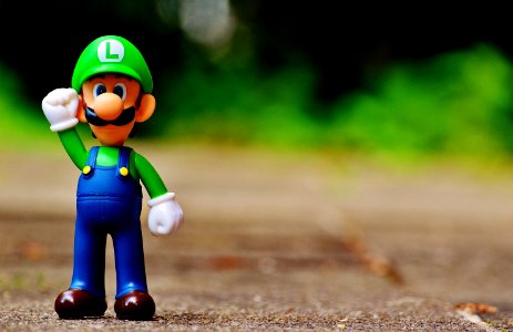 Shallow Focus Photography Of Luigi Plastic Figure photo