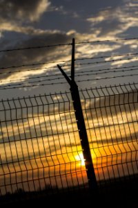 Gray Metal Fence During Sunset photo
