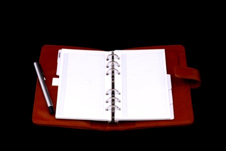 Red Leather Notebook With Silver Pen photo