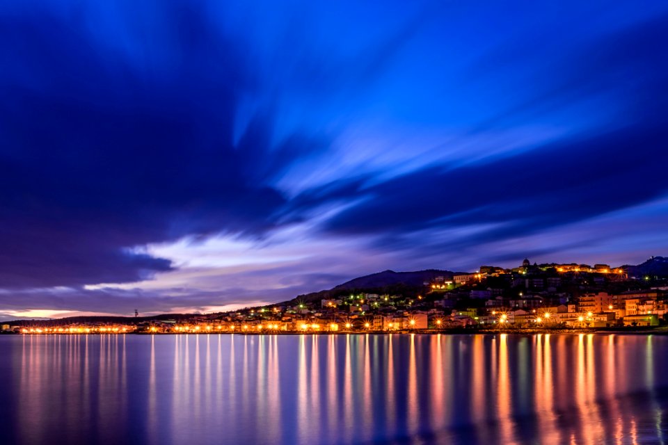 City Lights Reflecting From Sea