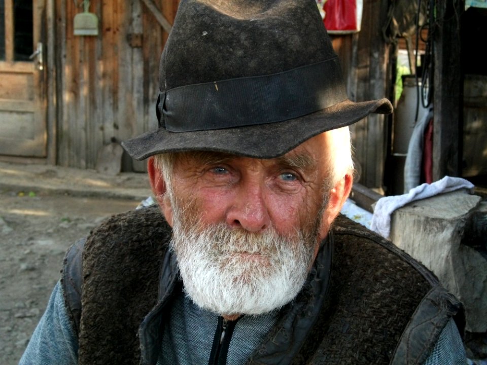 Man With White Beard Wearing Black Hat During Daytime photo