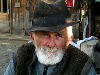 Man With White Beard Wearing Black Hat During Daytime photo