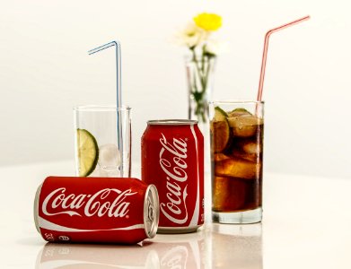 Coca Cola Cans And Glasses With Lines photo