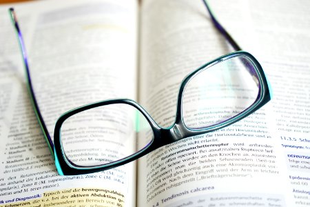 Reading Glasses On A Book