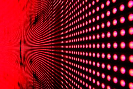 Red Lights In Line On Black Surface