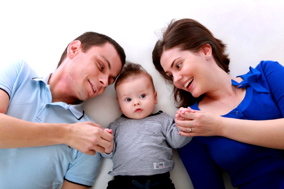 Man Beside Baby And Woman