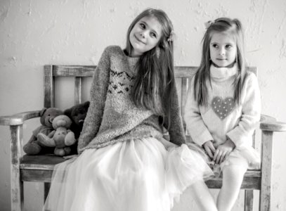 Portrait Of Happy Girls Sitting