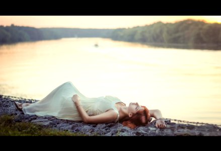 Woman Lying On Shore