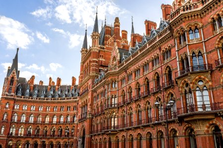 Brown Building During Sunny Blue Cloudy Sky