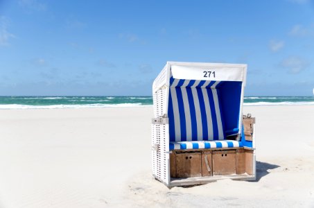 White And Blue Stripe Booth Number 271 On Seashore During Daytime photo