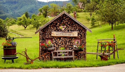Rustic Woodshed With Welcome Sign