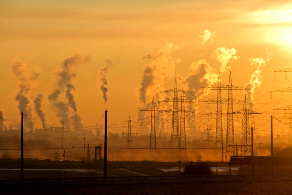 Polluting Smokestacks At Sunset