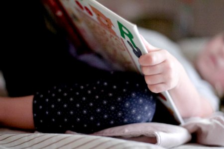 Public Domain- Little Girl Reading Book Bedtime Nap photo