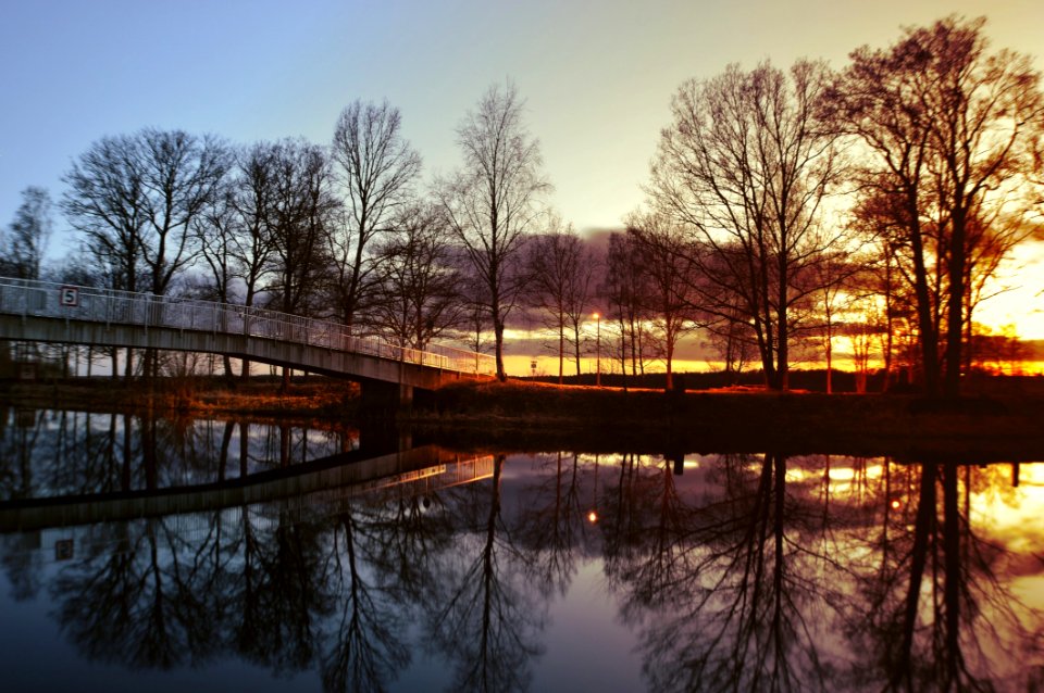 Bridge Over River At Sunset