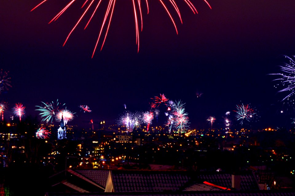 Fireworks Over City At Night