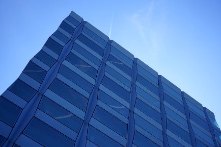 Corner Of Modern Building In Blue Skies photo