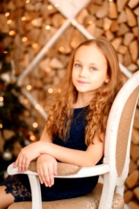 Portrait Of Girl Sitting On Chair