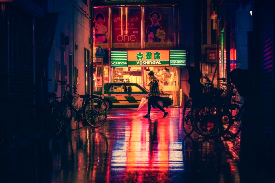 Side View Of Woman In Illuminated City At Night