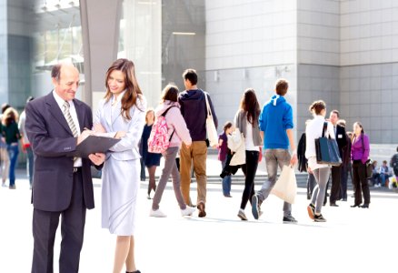 Women Standing In Front Of People photo