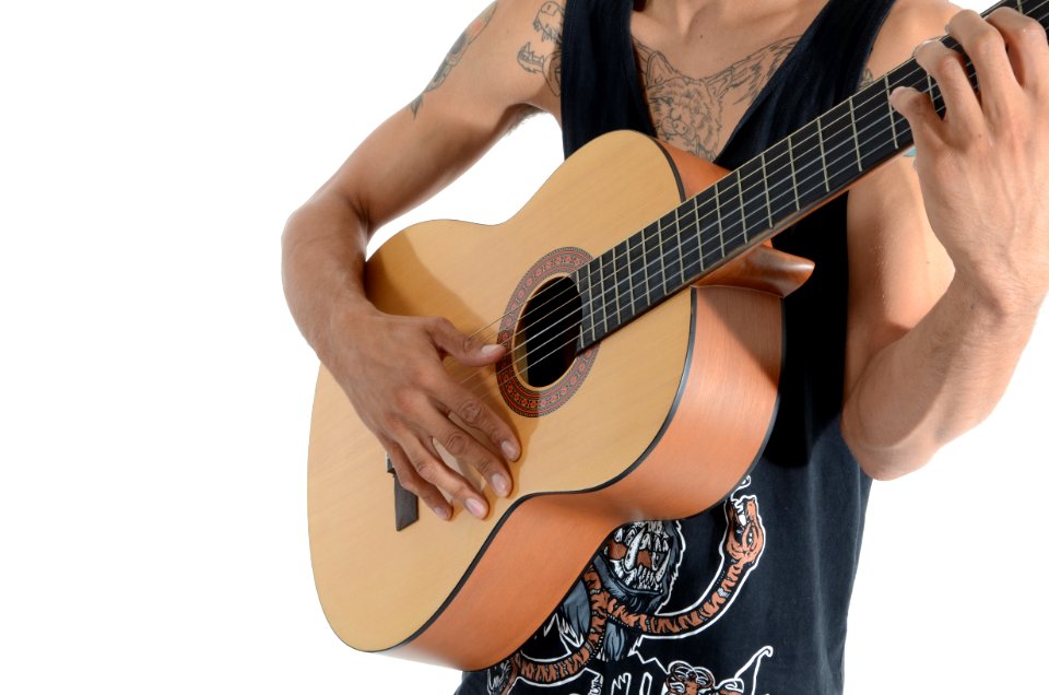Person In Black Tank Top Playing Acoustic Guitar