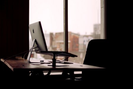 Apple IMac On Desk By Window photo