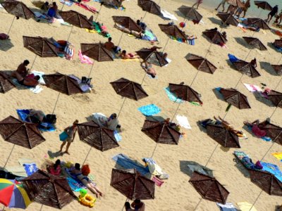 Beach Parasols With People