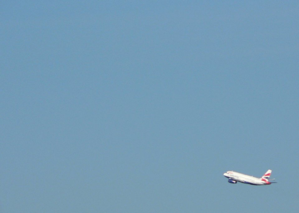 Airplane In Blue Sky