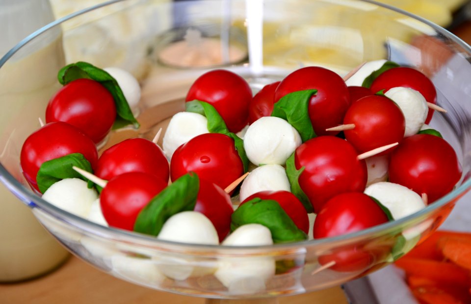 Red Round Fruit Served On Clear Glass Bowl