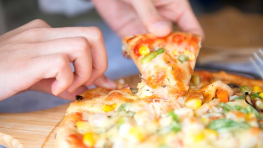 Grabbing Slice Of Pizza