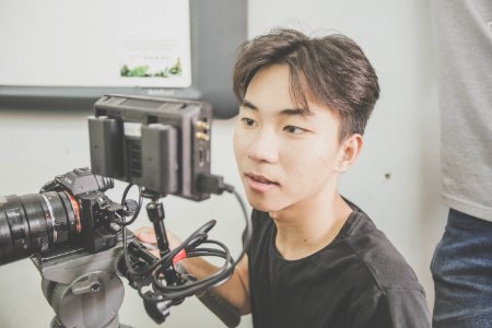 Asian Man With Camera