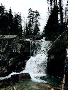 Scenic View Of Waterfall In Forest Against Sky photo