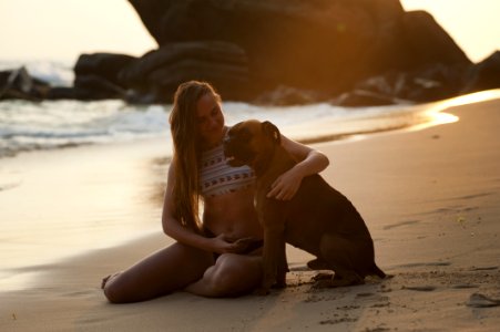 Woman On Beach With Dog photo