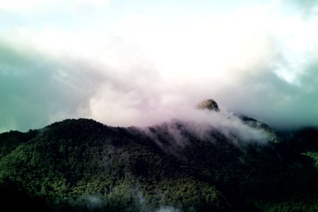 Clouds Over Forested Hillside photo