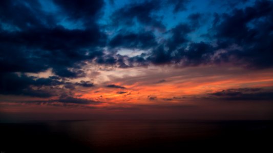 Painting Of Black Cloud During Sunset photo