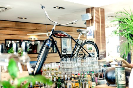 Black Cruiser Bicycle On Bar Table