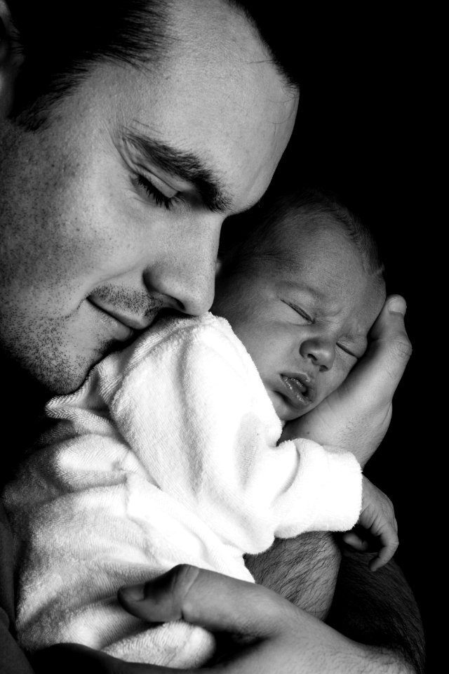 Men Carrying A Baby Greyscale Photography
