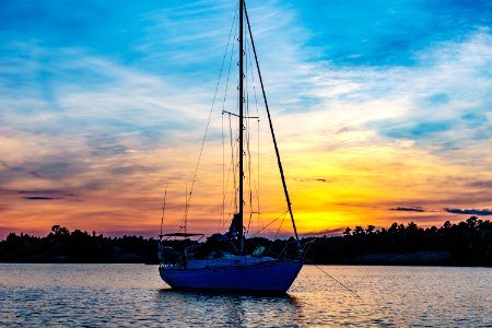 Boat At Sea At Sunset
