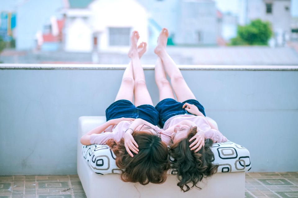 Twin Girls In Day Bed Outdoors