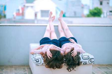 Twin Girls In Day Bed Outdoors photo