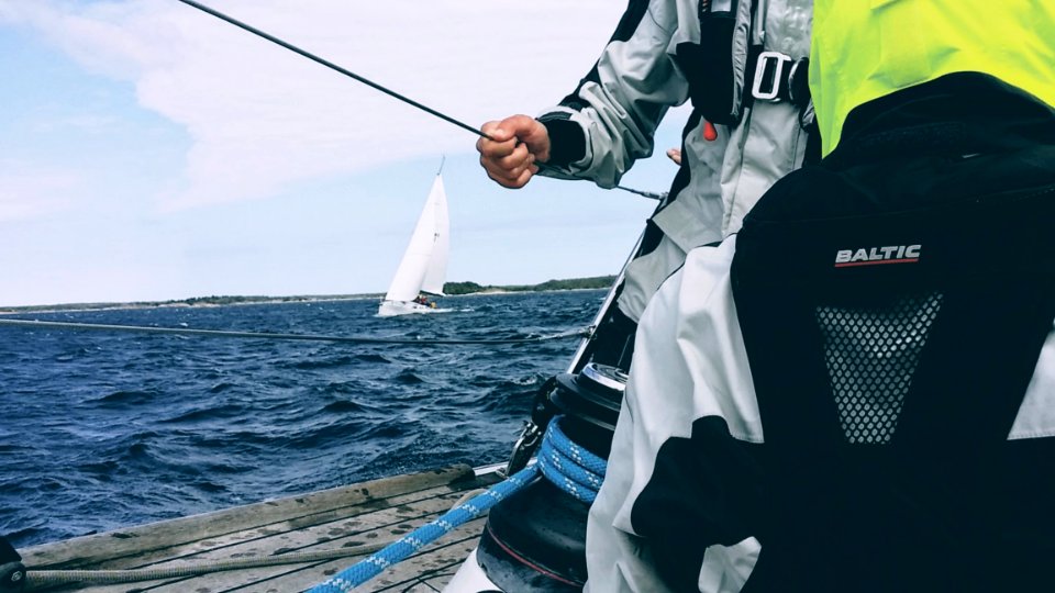 Man Holding Cable On Sailboat